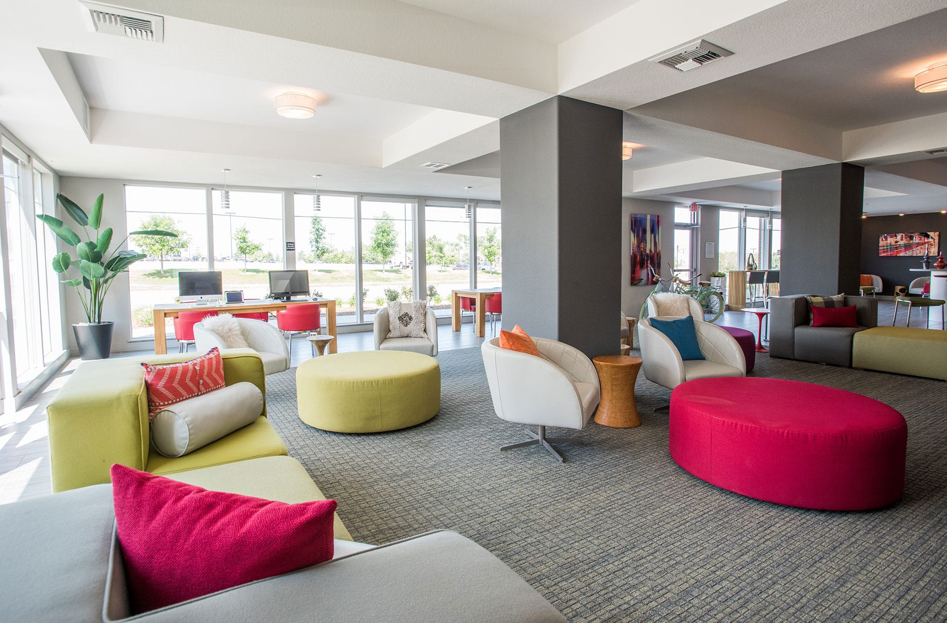 Lounge with colorful chairs and seating.