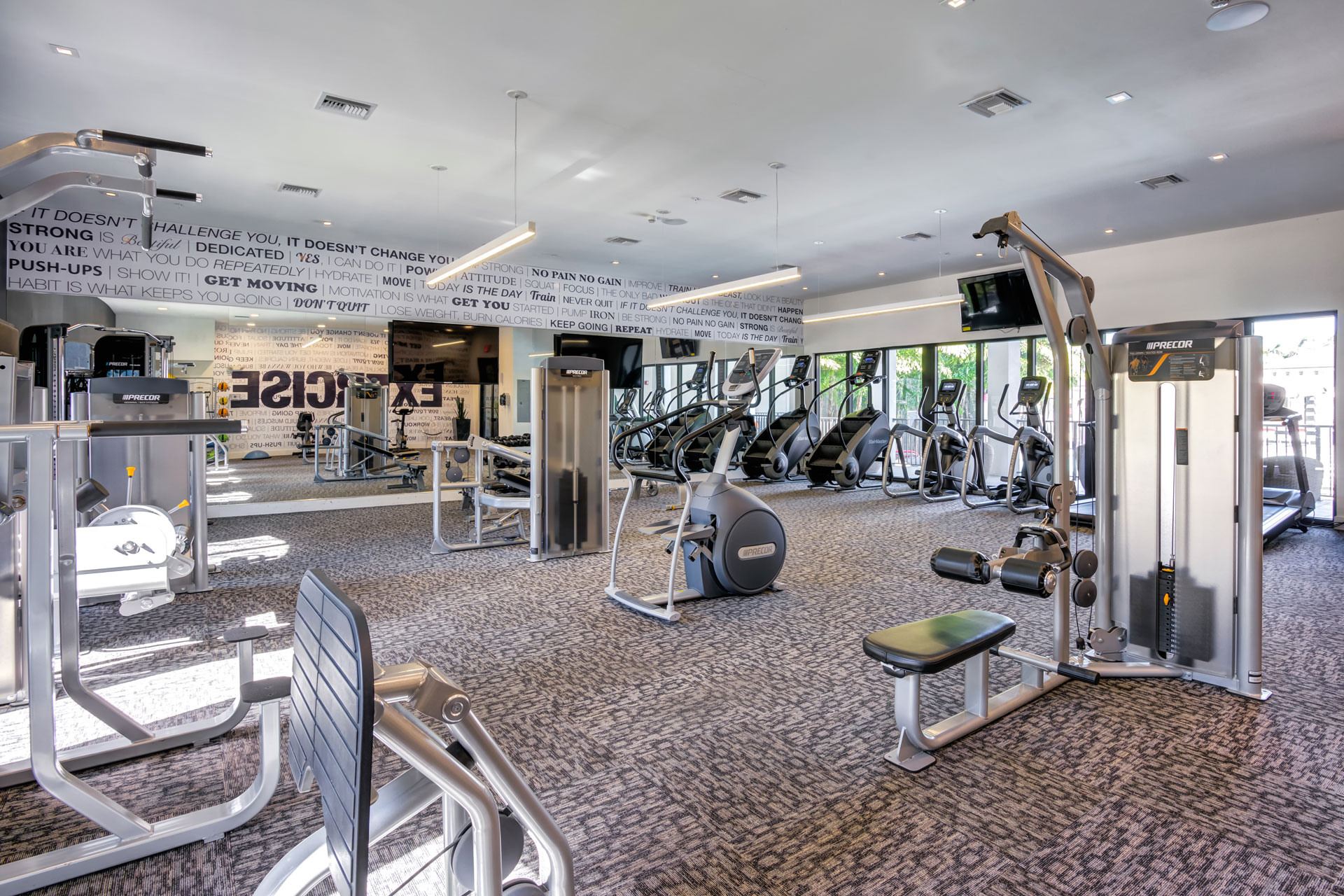 Fitness center with weight and cardio machines.