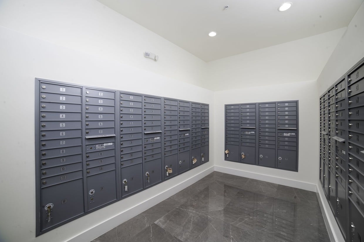 Mail room with grey mailboxes.