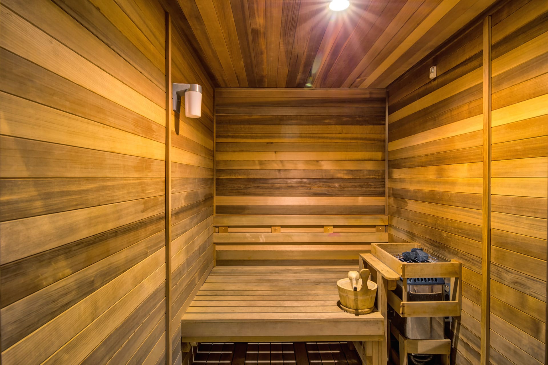 Wood sauna with bench.