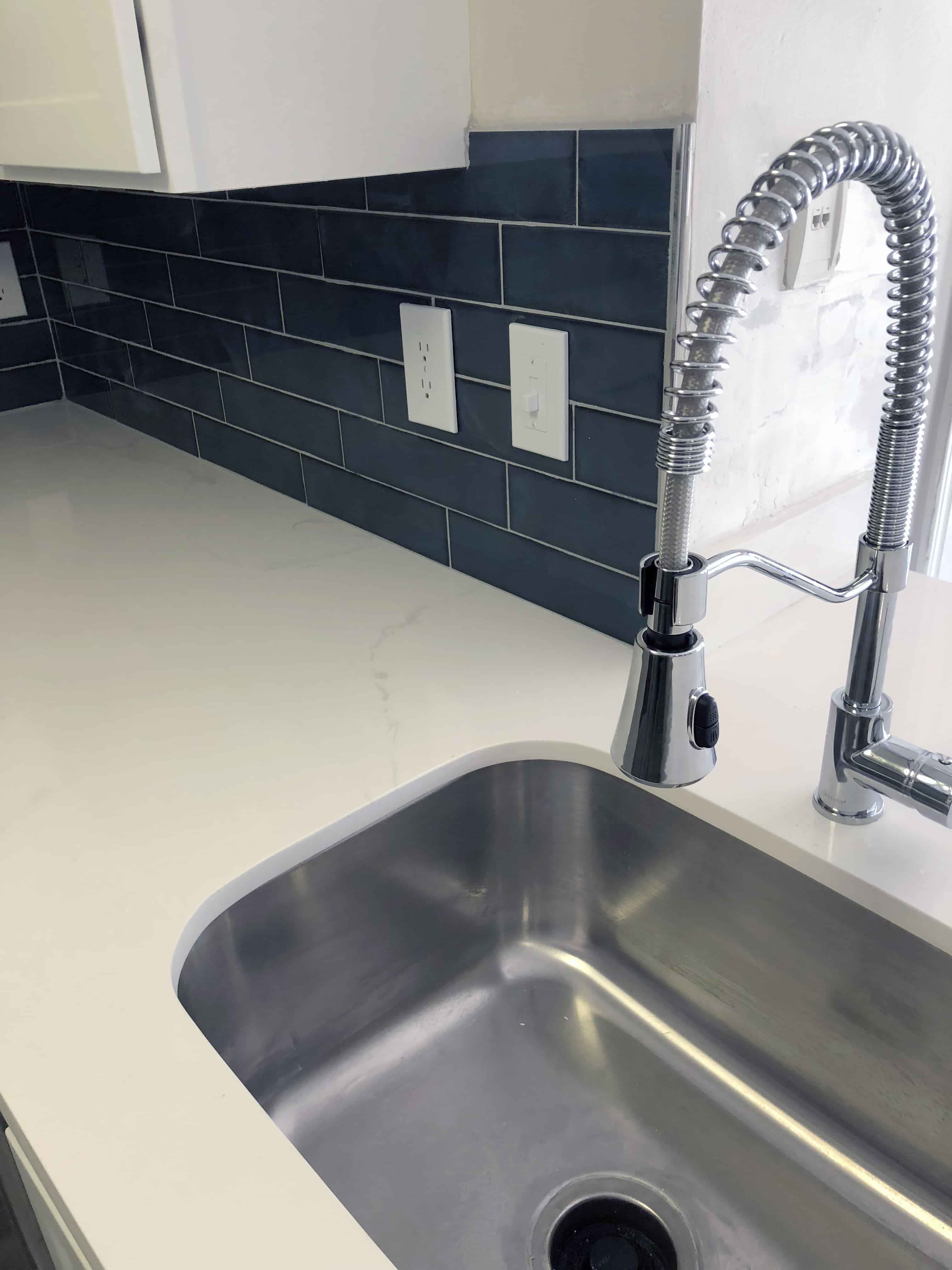 Designer Kitchens with Quartz Countertops, Subway Tile Backsplash and Upgraded Faucet