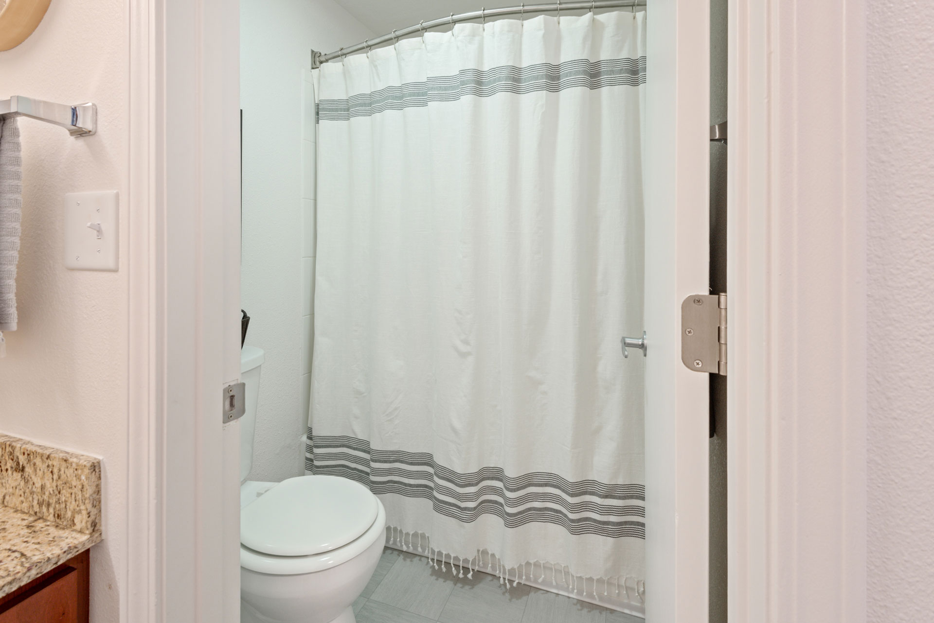 Tub shower with extended shower rod.